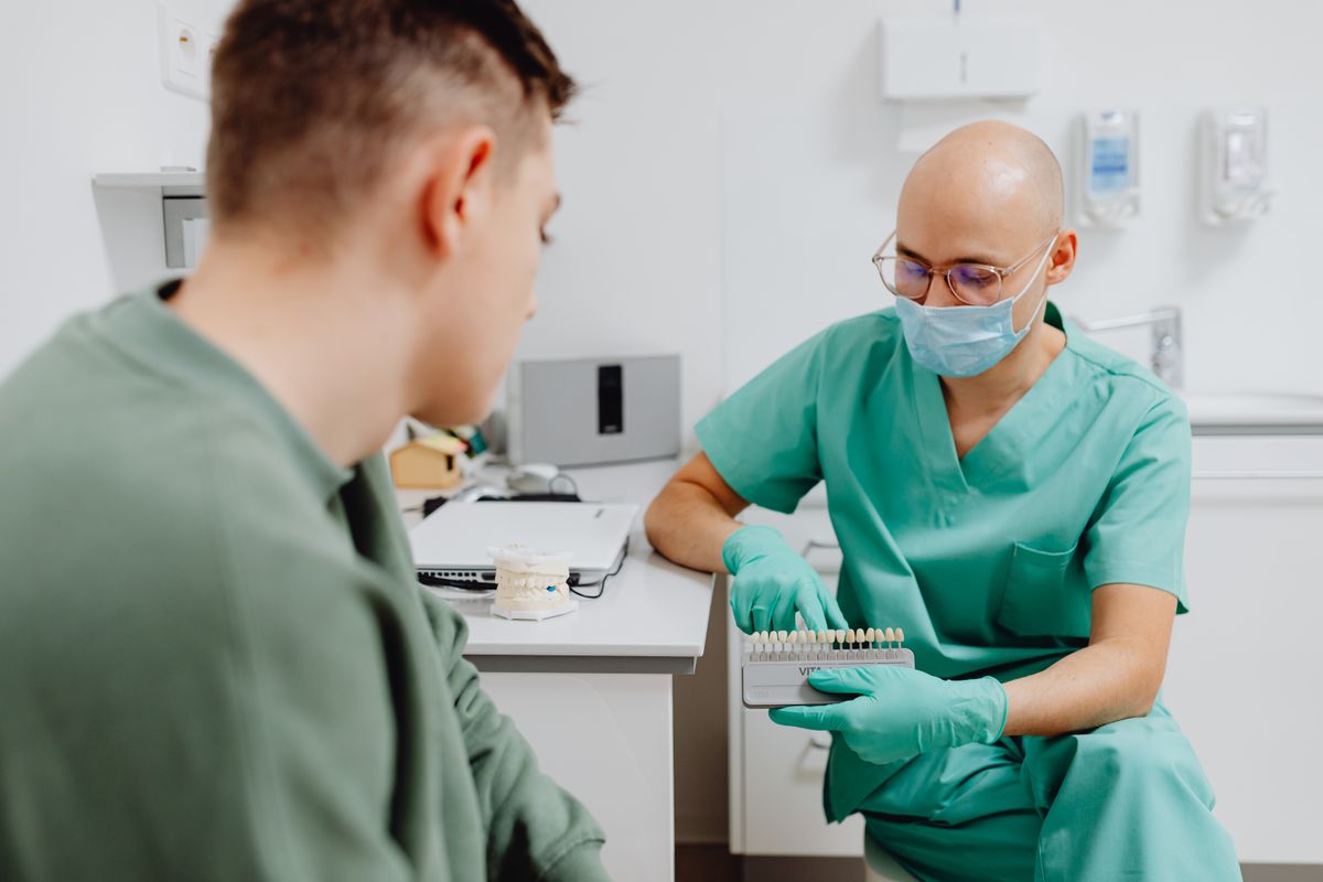 Dentist consulting with a patient