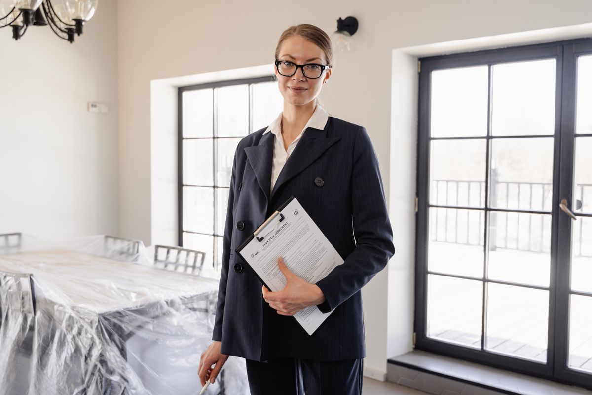 Real estate agent reviewing a purchase agreement